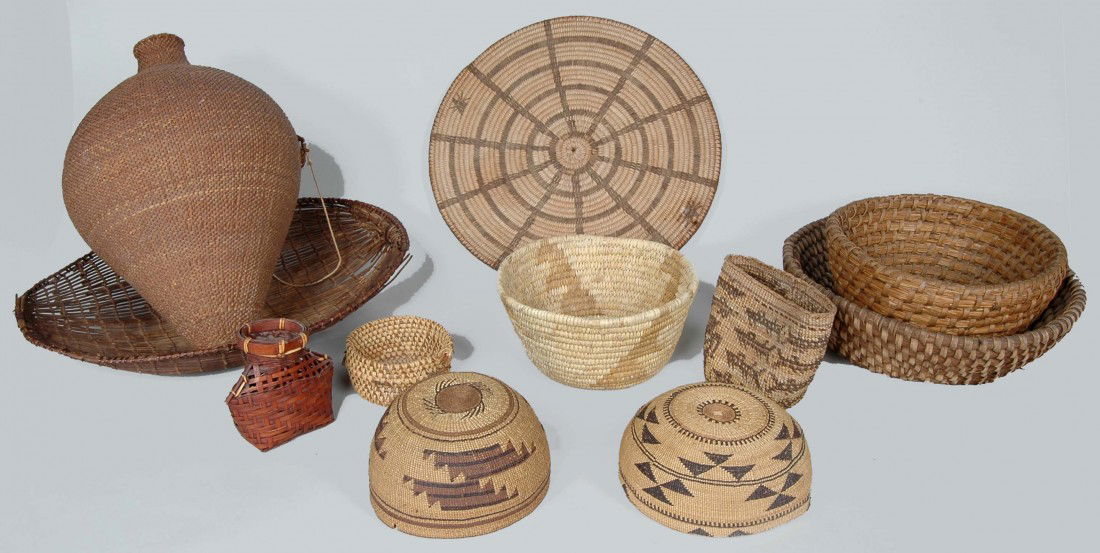 14. LOT OF 11 ANTIQUE WOVEN NATIVE AMERICAN BASKETS: LOT OF 11 ANTIQUE WOVEN NATIVE AMERICAN BASKETS, including two fine polychrome decorated Indian basketry caps, probably American Southwest or California. Ovoid vessel L.15"; Basket with salmon, three