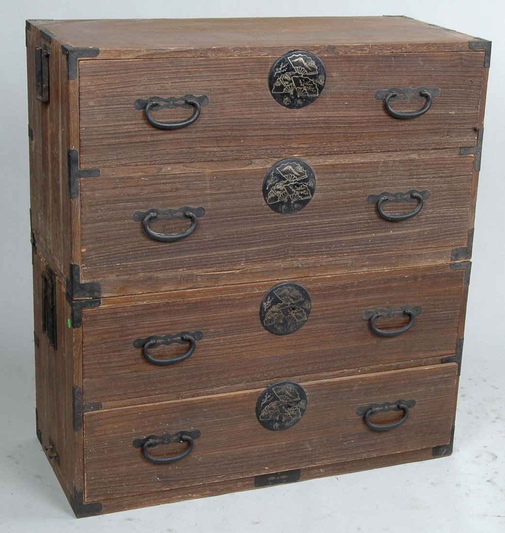 JAPANESE 2 PART TANSU W/SILVER INLAID IRON MOUNTS: JAPANESE 2 PART TANSU W/SILVER INLAID IRON MOUNTS, four drawers the large silver inlaid escutcheons with scenes of Mt. Fuji, metal side lifts. Ht. 40" W. 37" D. 16". Provenance: The estate of Ethelber