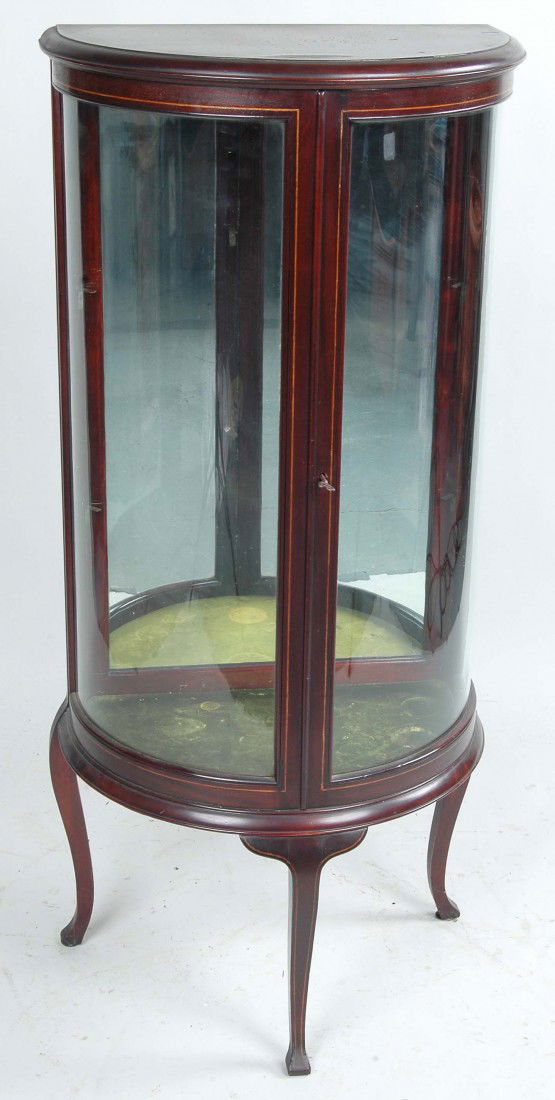 QUEEN ANNE STYLE MAHOGANY CURIO CABINET: QUEEN ANNE STYLE MAHOGANY CURIO CABINET of demilune form with lightwood inlay, 2 glass shelves. Ht. 51.5", W. 23.5", D. 14.25" Provenance: From the collection of Dr. Benjamin Weiner, longtime propriet