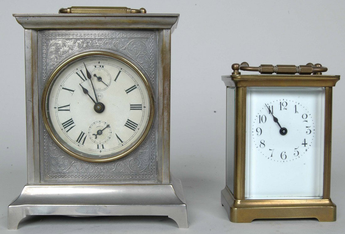 SETH THOMAS CARRIAGE CLOCK & FRENCH CARRIAGE CLOCK: SETH THOMAS CARRIAGE CLOCK & FRENCH CARRIAGE CLOCK, the Seth Thomas Ht. 5.75"example of silvered brass with second sweep hand. The French example Ht. 4.25" of brass with beveled glass.