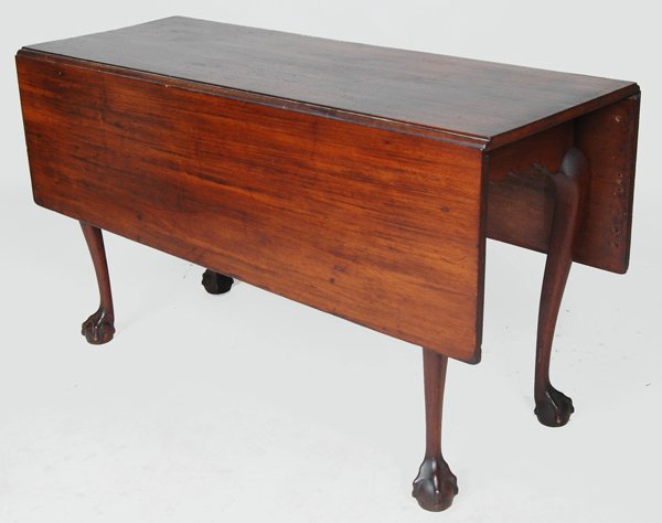 18TH C. SALEM CHIPPENDALE MAHOGANY DINING TABLE: having large overhanging top with deep drop leaves, scalloped carved frieze, cabriole legs with sharp-carved knees ending in ball and claw feet. By descent in the Ropes family, third quarter 18th cent
