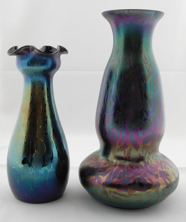 2 LOETZ PURPLE LAVA IRRIDESCENT ART GLASS VASES: the taller double gourd form body with pinched neck & flared rim, the smaller unsigned Loetz blue oil spot of baluster form with cup & ruffled rim. Ht. 10 1/2" & 8 1/2". Provenance: Estate of Lynn Red