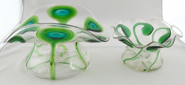 2 FAVRILLE GLASS PEACOCK FEATHER BOWLS: one with paper label GTD & Co. Ht. 5 3/4", W. 10 1/4"; Ht. 3 3/4", W. 7". Provenance: Estate of Lynn Redden, Houston, Delaware.