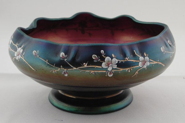 UNSIGNED LOETZ BOWL, AMETHYST IRRIDESCENT W/: ENAMELED APPLE BLOSSOMS, Ht. 3" Dia. 6 1/2". Provenance: Estate of Lynn Redden, Houston, Delaware.
