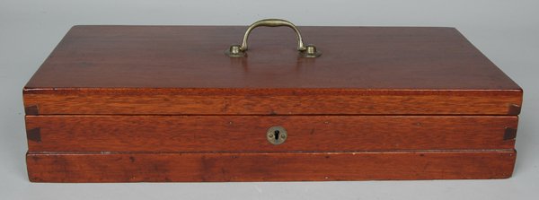 19TH C. ENGLISH MAHOGANY LIFT TOP BOX: with original bale handle, the hinged cover opening to a green baize lined fitted interior, steel lock with brass circular escutcheon.