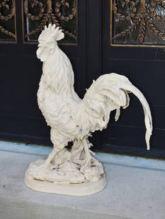 FINE FRENCH CHANTICLEER CAST IRON GARDEN ROOSTER: A well-delineated French cast iron rooster; the proudly prancing rooster with cocked head and dramatic comb and waddle above a well-plumed body with exuberant tail feathers; standing on an oval natura