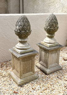 FINE PAIR OF CAST STONE ARTICHOKE GARDEN ORNAMENTS: ON SQUARE COLUMNS.The pedestals are 16" tall and 12" squareThe artichokes are 18 1/2" tall and 8" square at the base. Overall Height 34 1/2"