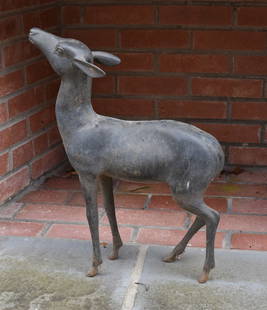 AN ITALIAN ORNAMENTAL CAST BRONZE GARDEN FAUN: Beautifully modeled of exceptional quality. Height 22" Length 17"