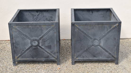 PAIR OF CLASSICAL STYLE LEAD FINISH METAL PLANTERS: Pair of Neoclassical style garden planters featuring a square cube with weathered zinc applied finish decorated with a circle and geometric cross pattern sides. Each planter has a drain hole in the