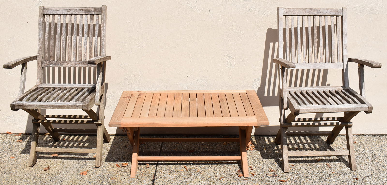 PAIR OF TEAKWOOD ARMCHAIRS AND LOW TABLE (1 of 1)