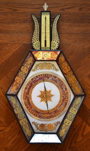 LATE 18TH CENTURY FRENCH EGLOMISE BAROMETER: The top with lyre crest centering a thermometer with original carved finial above a hexagonal shaped canted dial surround of red eglomise panels with gilt decoration centering a white fielded