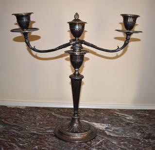 LARGE JOHN SCHOFIELD STERLING CANDELABRA, LONDON: 1791/1792. This monumental sterling silver two light candelabra by the celebrated silversmith John Schofield, whose "candlesticks are the finest of the period" 74 troy ounces. Height 19" Provenance: M
