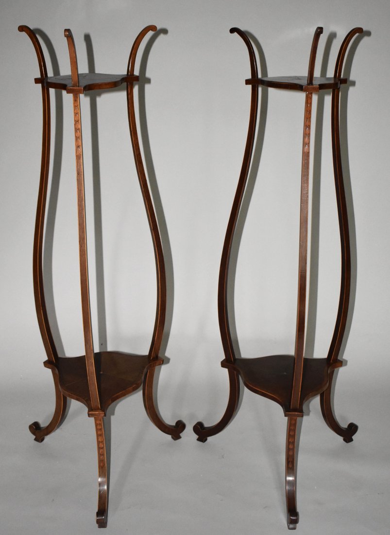 RARE PAIR OF 18TH CENTURY SATINWOOD PEDESTALS: In the manner of designs executed by the Robert Adam's. The stands consisting of three delicate scroll sawn serpentine supports connected by serpentine formed upper and lower shelves, the supports wit