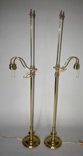 PAIR OF POLISHED BRASS & STEEL ADJUSTABLE FLOOR LAMPS: The lamps with decorative turned finial steel rod with adjustable brass arm on brass shaft with circular foot. Fine quality recently polished and laquered Height 63 1/2"