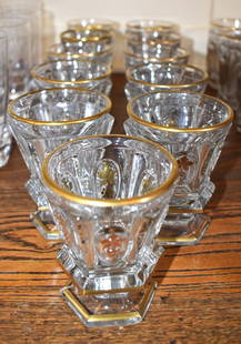 11 BACCARAT CHARLES X DESIGN CRYSTAL GLASSES: The hexagonal glasses with raised oval reserves with gilt vintage decoration on pedestal bases. Height 4 1/4" Diameter 2 3/4"