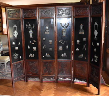 CHINESE SIX PANEL JADE, HARDSTONE & CLOISSONE SCREEN: A magnificent Chinese six panel lacquered hardstone, jade and cloissone overlaid carved wood & laquered screen. Qing Dynasty. Comprising three pairs of screen panels each with overlaid jade and hardst