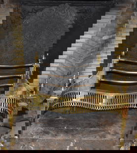 ENGLISH ADAMS PERIOD BRASS RETICULATED COAL GRATE: The grate with cast iron arched back with paired dolphin form crest above a central panel featuring an English rose, the front with three bowed steel rails flanked by a bead decorated engraved brass f