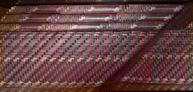 FINE BINDINGS: "DICKENS COMPLETE WORKS" 30 VOLUMES: Red calfskin half leather binding with tooled gilt lettering over marbled boards, New York: Harper & Brothers