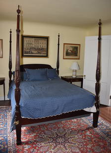 FINE CHARLESTON STYLE MAHOGANY RICE CARVED BED: The mahogany bed with carved urn form finials acanthus carved reeded posts with rice carved balusters on square tapering legs ending in spade feet. Height 89" Length of rails 79" x 59" Posts 3 1/2" sq