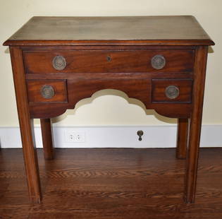 ANTIQUE CHIPPENDALE MAHOGANY DRESSING TABLE: The Chippendale mahogany dressing table with a molded rectangular top above long drawer above two short drawers, cyma carved scalloped skirt on straight molded legs. Height 28 1/2" Width 30" Depth 17