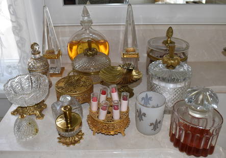 FINE LOT OF LADIES PERFUME & DRESSER JARS: Including a Balenciaga oval perfume bottle, Baccarat rectangular perfume, dresser jars, two ormolu mounted glass obelisks Height 10", and two powder jars, etc.