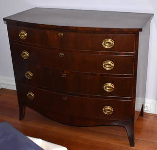 AMERICAN HEPPLEWHITE MAHOGANY BOW FRONT CHEST: Early 19th century, The chest with four graduated cockbeaded drawers fitted with oval brass plates with bale handles & escutcheons, serpentine skirt raised on well formed French feet. Height 38" Width