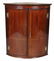 ENGLISH REGENCY BARREL FORM HANGING CORNER CABINET