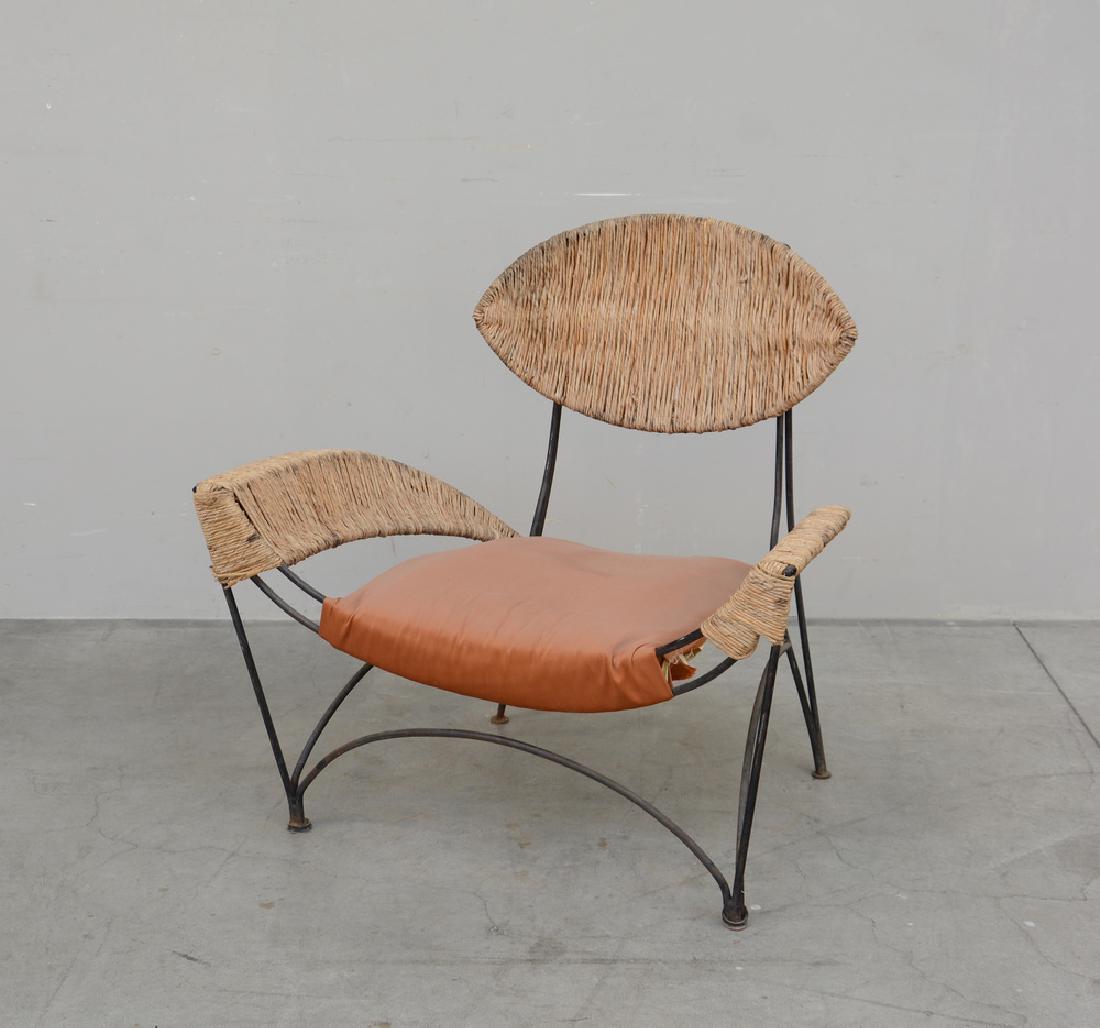 Tom Dixon Poltrona modello "Baby Fat". Struttura: Tom Dixon Poltrona modello "Baby Fat". Struttura in tondino metallico, seduta, schienale e braccioli in paglia. Prosuzione Cappellini, Italia 2012 (cm 94x91x68) (difetti)