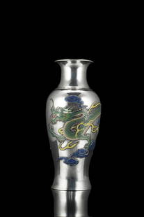 A silver baluster vase decorated with a dragon, with: A silver baluster vase decorated with a dragon, with details highlighted in coloured enamels China, 20th century (h. 22 cm.; weight 563 gr.)