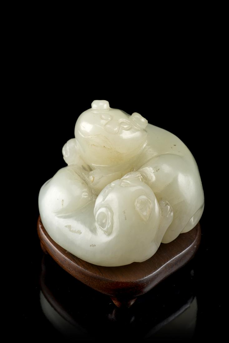A celadon jade cat group, wood baseChina, 19th/20th (1 of 1)