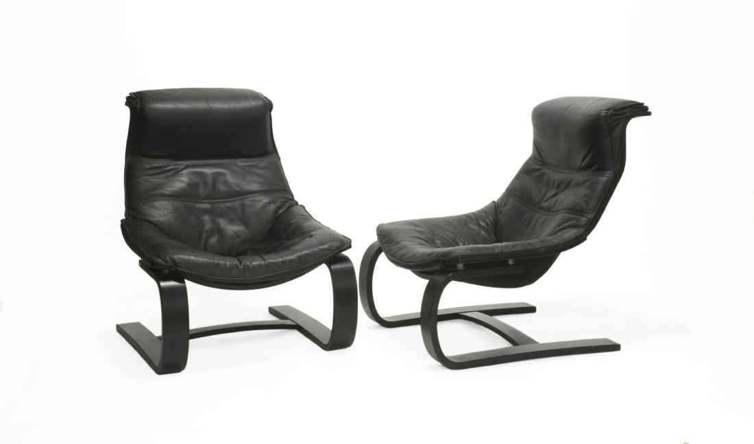 Coppia di poltrone con struttura in legno curvato,: Pair of armchairs with curved wooden structure, seat and back seat in fabric and black leather. Produced by nord europea, 1970s. (73x94x75 cm.) (slight defects)Coppia di poltrone con struttura in legn