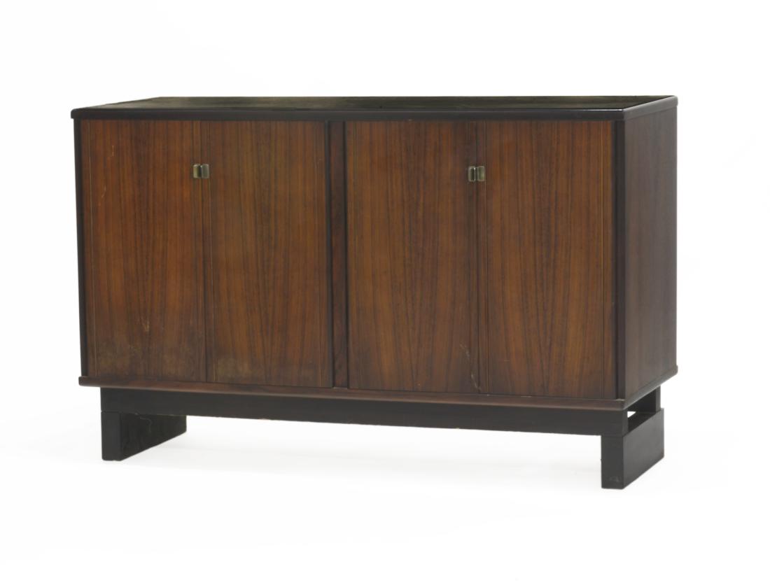 Claudio Salocchi (Milano 1934 - Milano 2012)Stipo a: Claudio Salocchi (Milano 1934 - Milano 2012)Four- door forniture in veneered indian rosewood of the series "SC66". Produced by Sormani, Italy, 1960s. (132x85.5x52.5 cm.) (defects)Literature"Abitare" n
