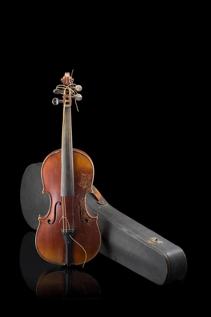 Violin of Mirecourt school, 1890s-1900s ca. Two-piece: Violin of Mirecourt school, 1890s-1900s ca. Two-piece back of narrow curl, varnish of a red brown colour, fair condition, unlabelled and unstamped (lenght of back mm 358). With case and serial German