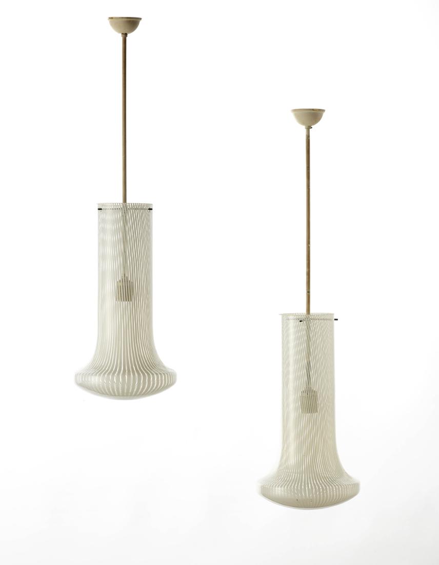 Venini Pair of suspension lamps of the series: Venini Pair of suspension lamps of the series "Boletus". Murano, 1970s. Lattimo and colorless blown glass, white painted brass structure. (h 84.5 cm.) (slight defects) IT Coppia di lampade a sospensio