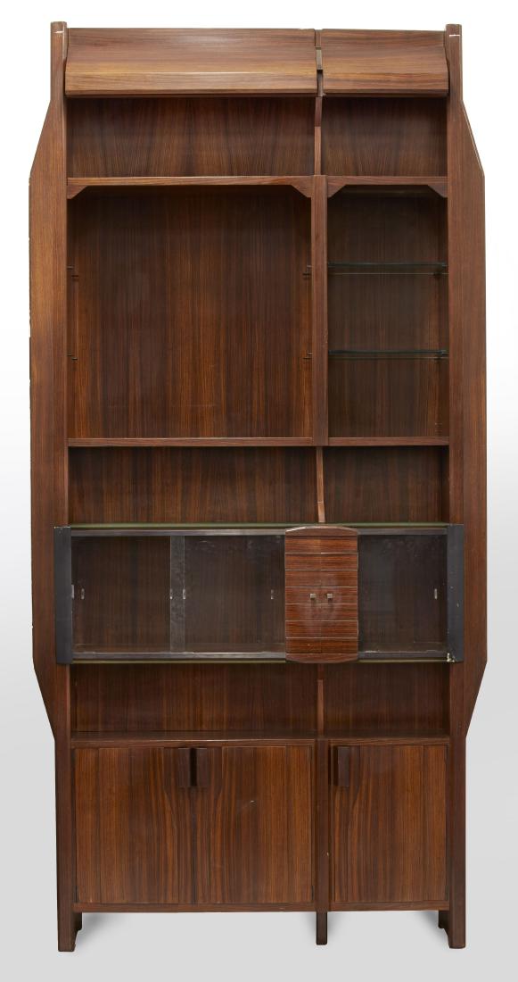Renato Angeli Bookcase in Indian rosewood, with three: Renato Angeli Bookcase in Indian rosewood, with three cabinets in the lower part, a central display case with sliding doors and tabernacle, shelves in wood and glass. Italy, 1960s. (142x288x43 cm.) (s