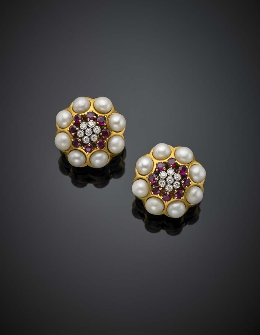 Diamond, pearl and ruby yellow gold stylized flower: Diamond, pearl and ruby yellow gold stylized flower earclips, g 32.4, diam. cm 2.5. IT Orecchini a lobo perno e clips in oro giallo, con diamanti per complessivi ct. 0,40 circa e rubini per complessiv