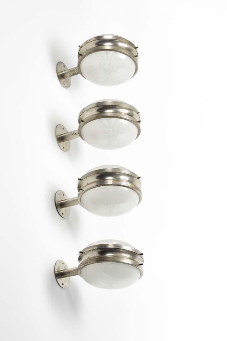 Sergio Mazza (Milano 1931) Lot of four appliques model: Sergio Mazza (Milano 1931) Lot of four appliques model "Sigma". Produced by Artemide, Milan, 1960s. Nickel-plated brass, printed glass. (cm l 27. cm d 20) (slight defects and small losses) IT Lotto co