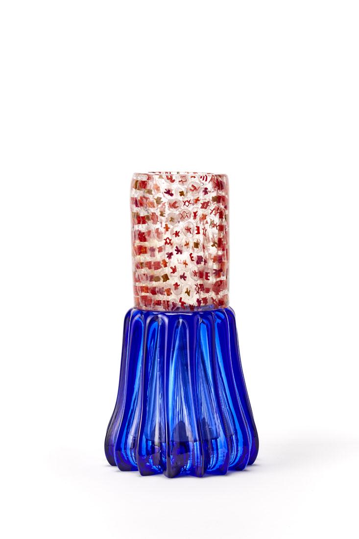 Riccardo Licata (Torino 1929 - Venezia 2014) Vase with: Riccardo Licata (Torino 1929 - Venezia 2014) Vase with cylindrical body in transparent colorless blown glass with inclusion of red, orange, amethyst and ocher murrine. Truncated cone base in blue ribb