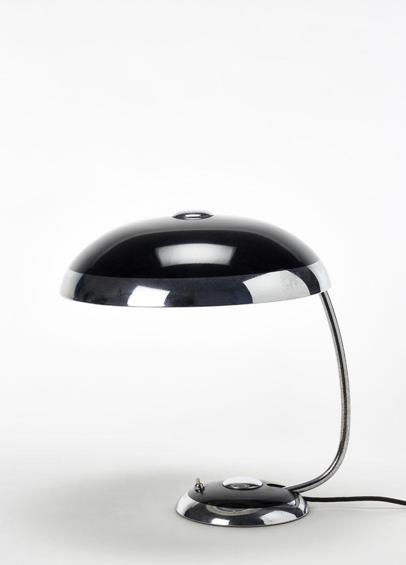 Mauser Werke Table lamp inspired by Bauhaus models.: Mauser Werke Table lamp inspired by Bauhaus models. Waldeck, Germany, 1949ca. Black and chromed painted metal. (h 48 cm.; d 41 cm.) IT Lampada da tavolo ispirata ai modelli Bauhaus. Waldeck, Germania,