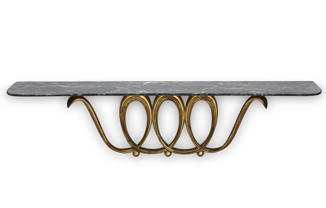 Osvaldo Borsani (Varedo 1911 - Milano 1985): Osvaldo Borsani (Varedo 1911 - Milano 1985) Console-shelf. Execution by Atelier Borsani, Varedo, 1940ca. Gilded wood carved with volutes and ovules, shelf in green Alpi marble. (181x43x35 cm.) (slight