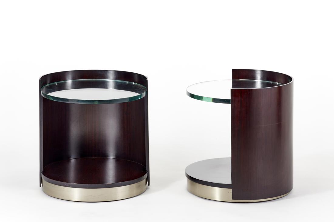 Gianni Moscatelli (1930) Pair of cylindrical bedside: Gianni Moscatelli (1930) Pair of cylindrical bedside tables. Produced by Formanova, Meda, 1970s. Black lacquered wood, one drawer in the lower part, thick glass top, brushed steel base. (h 52 cm.; d 5