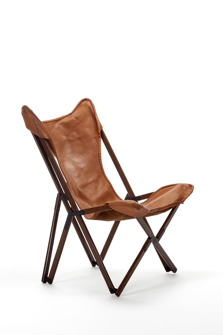 Ditta ViganÃ² "Tripolina" armchair. Italy,: Ditta ViganÃ² "Tripolina" armchair. Italy, 1960s/1970s. Structure in solid teak wood, back in Terra di Siena leather. (70x104x80 cm.) (defects) Literature I. de Guttry, M. P. Maino, Il mobile dÃ©c