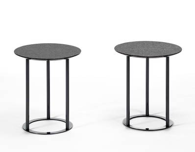 Laura Griziotti (1942) Pair of round tables. Produced by Arflex, Italy, 1981. Black painted steel: Laura Griziotti (1942) Pair of round tables. Produced by Arflex, Italy, 1981. Black painted steel structure, granite top. (h 45.5 cm.; d 40 cm.) Literature G. Gramigna, Repertorio del design italiano