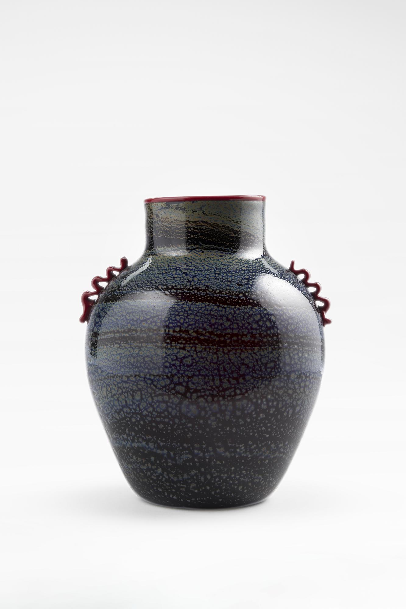 Giuseppe Chiacigh (Wladikawkaz 1895 - Trieste 1967) Dark amethyst blown glass morise vase with: Giuseppe Chiacigh (Wladikawkaz 1895 - Trieste 1967) Dark amethyst blown glass morise vase with silver leaf and metal oxide application in shades of blue-gray. Red glass paste hot-appled neck rim and m