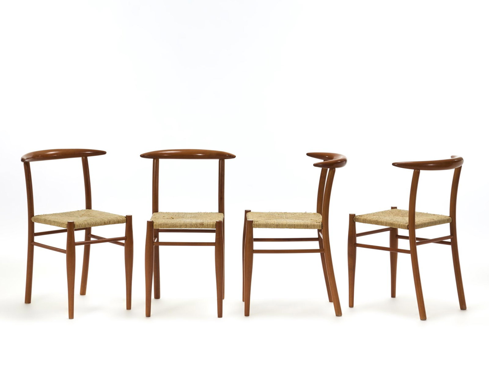 Philippe Starck (Parigi 1949) Four chairs model "Tessa Nature". Produced by Driade Aleph, Milan,: Philippe Starck (Parigi 1949) Four chairs model "Tessa Nature". Produced by Driade Aleph, Milan, 1989. Structure and back in solid beech wood, seat in woven straw. Branded with fire. (75x51x46 cm.) (s