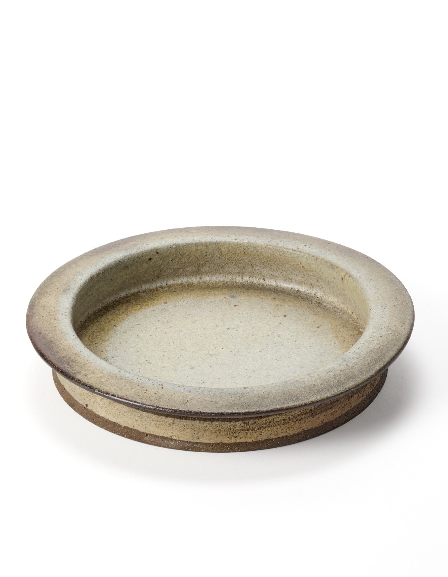 Nanni Valentini per Ceramica Arcore Plate. Italy, 1970s. Ceramic enamelled in: Nanni Valentini per Ceramica Arcore Plate. Italy, 1970s. Ceramic enamelled in grey-white and brown. Signed "NV". (h 4 cm.; d 24 cm.) IT Piatto. Italia, anni '70. Ceramica smaltata in bianco-grigio e b