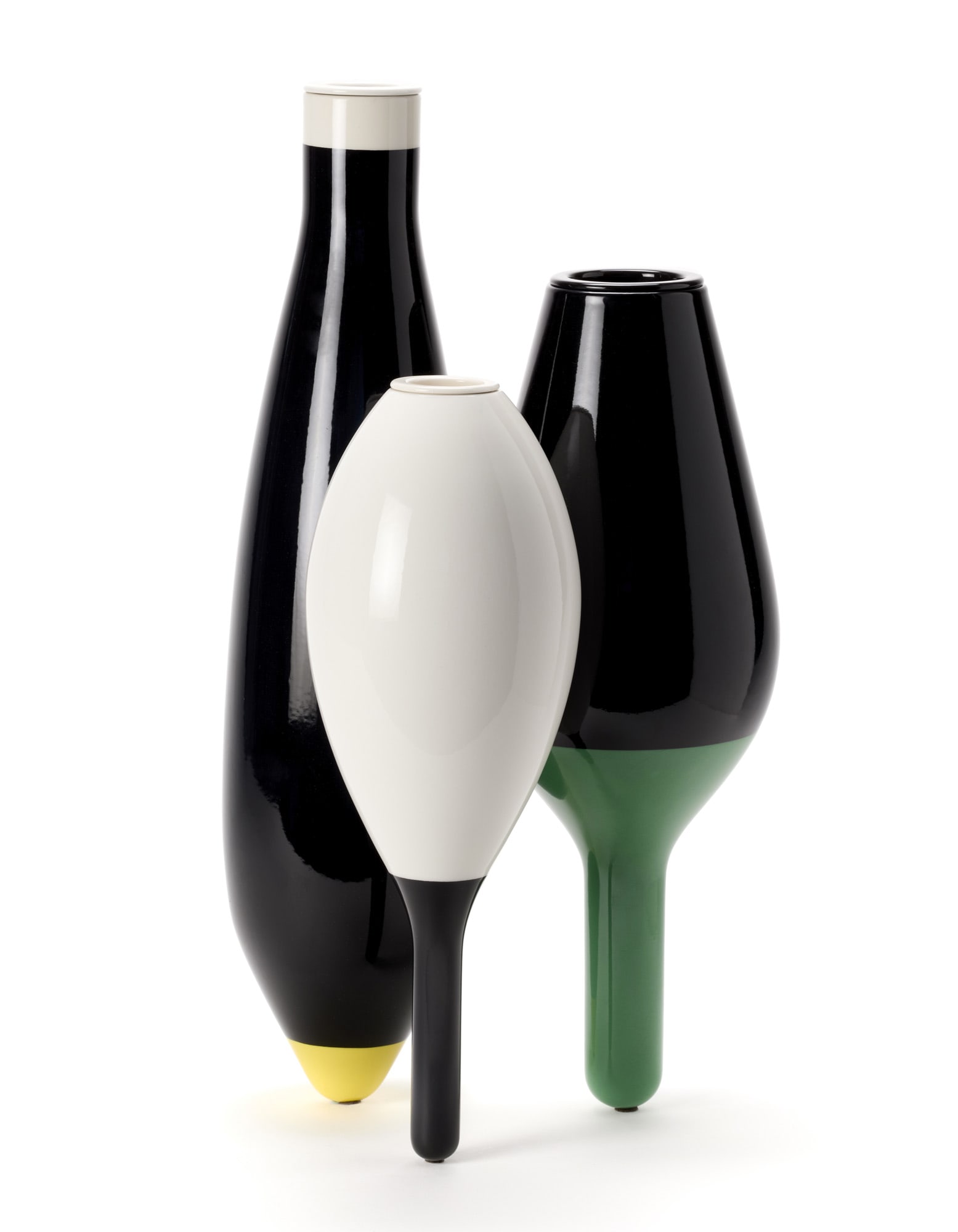 François Azambourg (1963) "Trois vases" Sculpture vases. Produced by Cappellini,, 2008. Three: François Azambourg (1963) "Trois vases" Sculpture vases. Produced by Cappellini, 2008. Three elements with ceramic flower holders enamelled in black, white, green and yellow. (h 60 cm.) IT "Trois vas