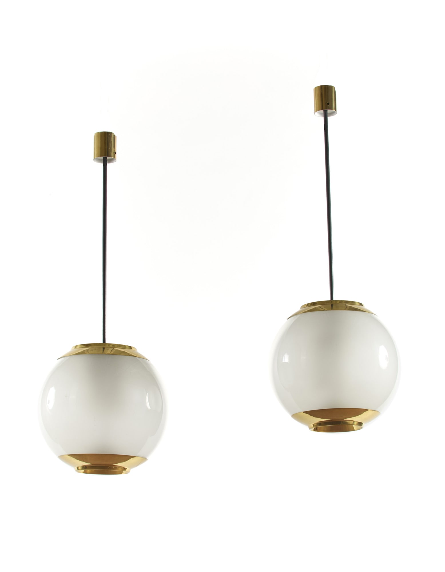 Luigi Caccia Dominioni (Milano 1913 - 2016) Pair of suspension lamps model "LS2". Produced by: Luigi Caccia Dominioni (Milano 1913 - 2016) Pair of suspension lamps model "LS2". Produced by Azucena, Milan, disegno del 1952. Brass and frosted glass on the inner surface. (h 120 cm.) Literature "Do