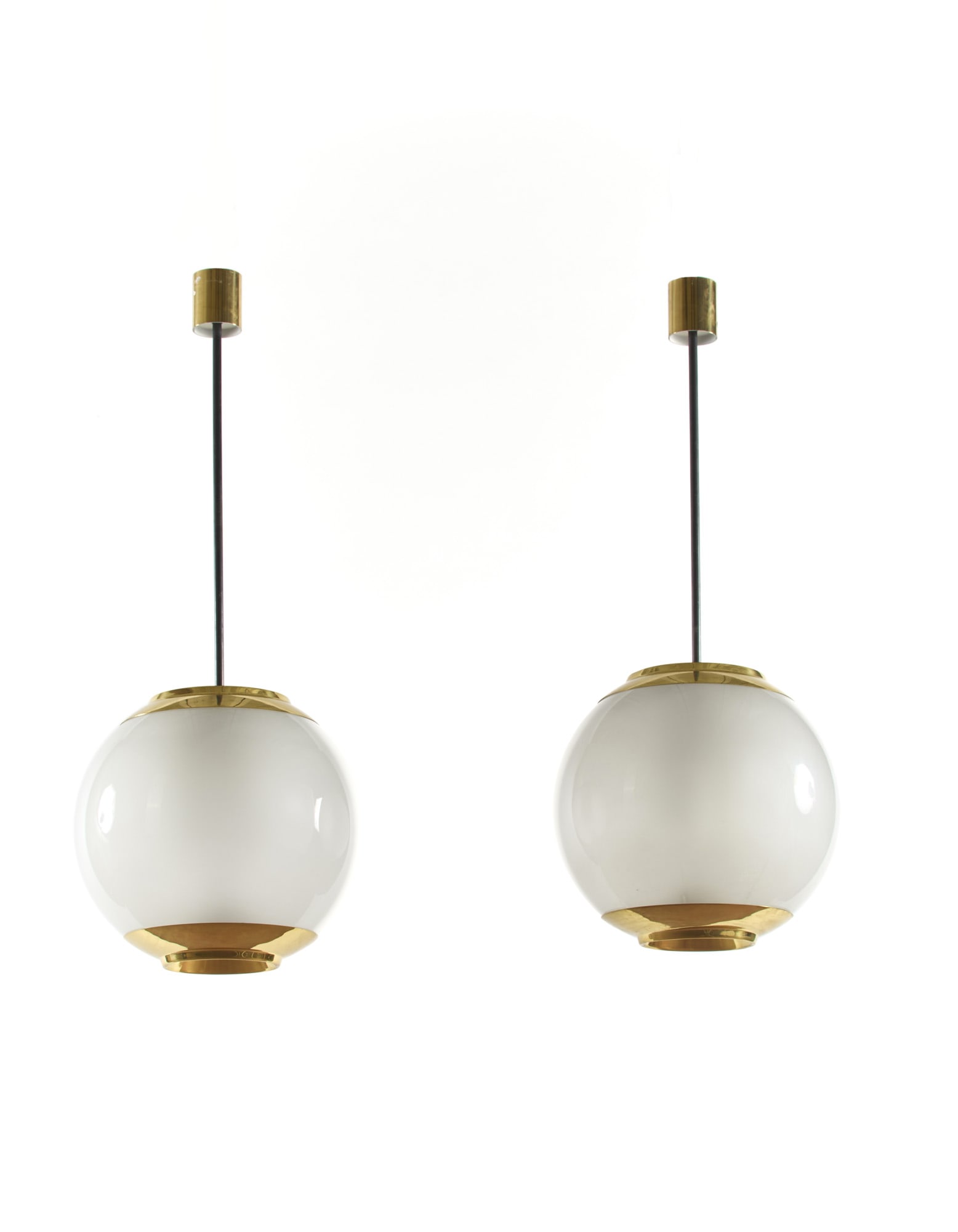 Luigi Caccia Dominioni (Milano 1913 - 2016) Pair of suspension lamps model "LS2". Produced by: Luigi Caccia Dominioni (Milano 1913 - 2016) Pair of suspension lamps model "LS2". Produced by Azucena, Milan, disegno del 1952. Brass and frosted glass on the inner surface. (h 120 cm.) Literature "Do