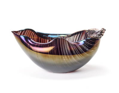 Tyra Lundgren (Stoccolma 1897 - 1979) Leaf-shaped vase made of transparent blown glass with amethyst: Tyra Lundgren (Stoccolma 1897 - 1979) Leaf-shaped vase made of transparent blown glass with amethyst rods and strongly iridescent surface. Murano, 1981. Signed and inscribed in point under base “ven